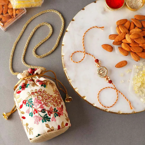  Ganesha Rakhi With Almonds And Mishri In Potli